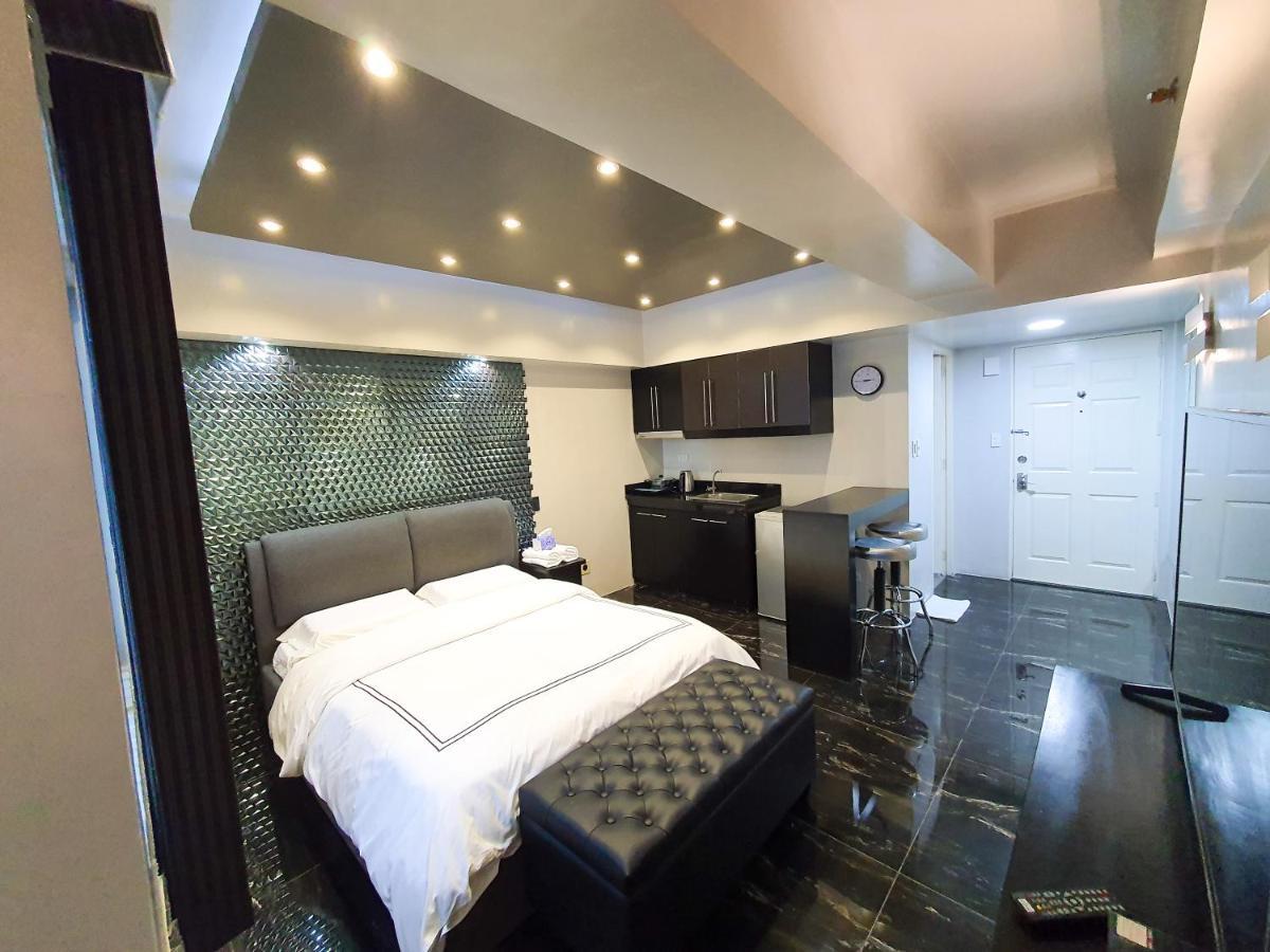 Burgundy Mckinley Place Service Apartment Манила Экстерьер фото