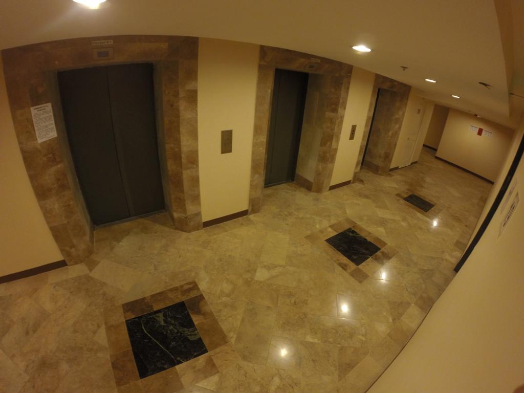 Burgundy Mckinley Place Service Apartment Манила Экстерьер фото